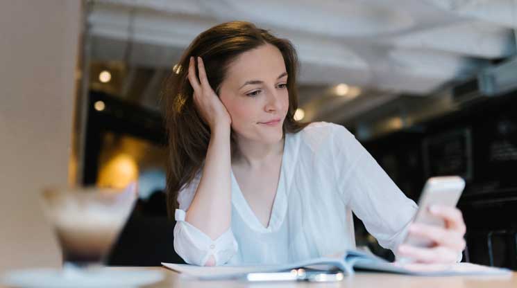 Woman spending time on her phone