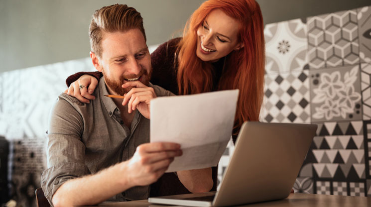 Wife and Husband looking at financial documents