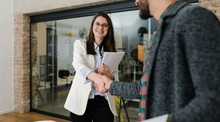 Woman interviewing a man for a job