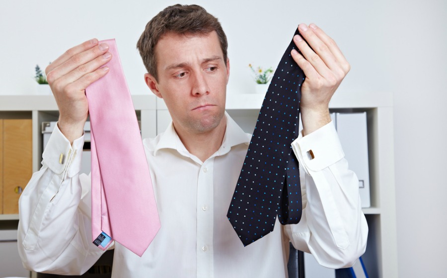 Confused Man in Office Comparing his Ties