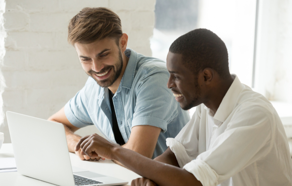 employees looking at laptop