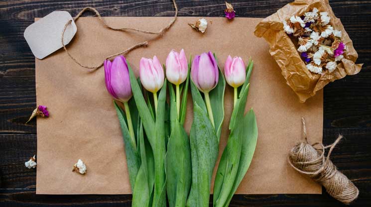 Flowers on a cutting board