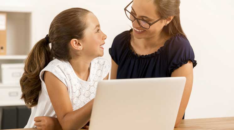 Mom and Daughter working on computer