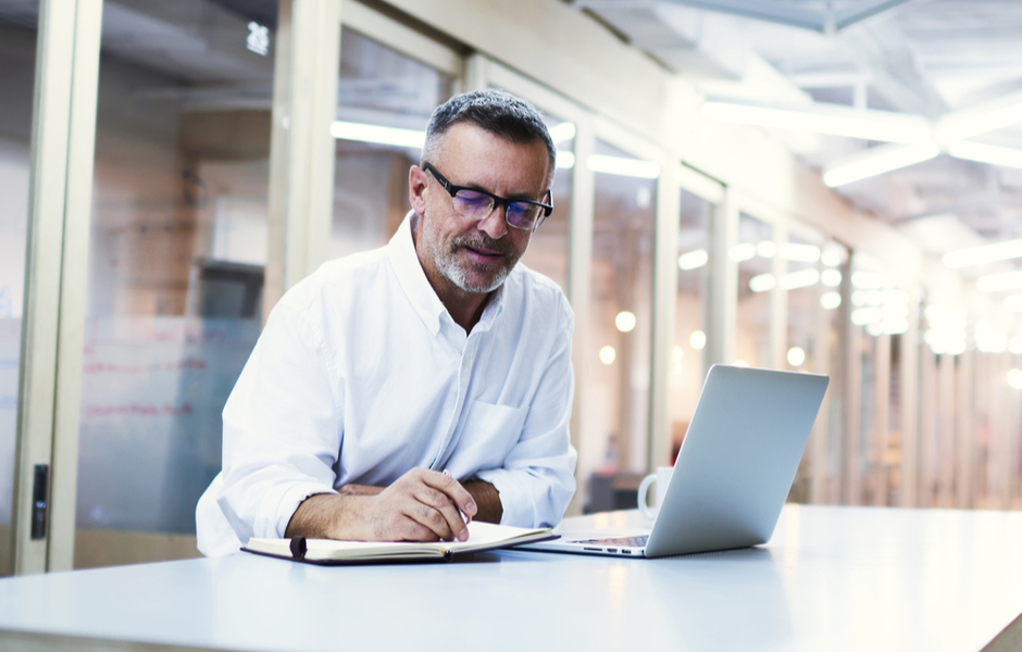 professor working with laptop