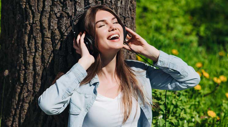 Woman singing with headphones on